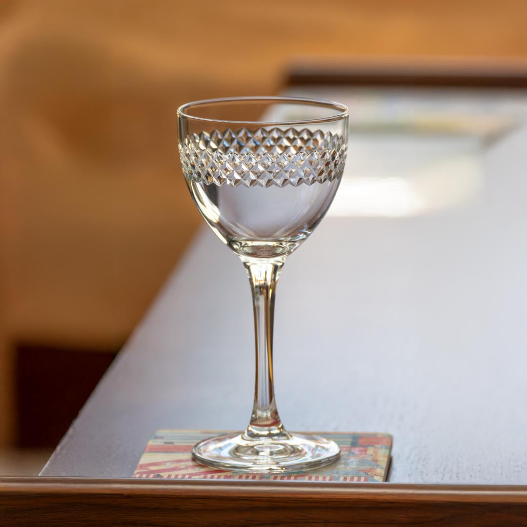Rolf Glass Diamond 5oz Nic & Nora Classic Cocktail Glass on a coffee table