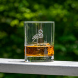 Rolf Glass Flamingo whiskey glass on an outdoor table
