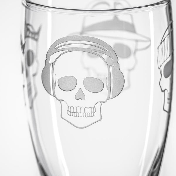 Rolf Glass Numbskulls 20oz Large Beer Pilsner Glass showing detailed engraving of skill with beats headphones