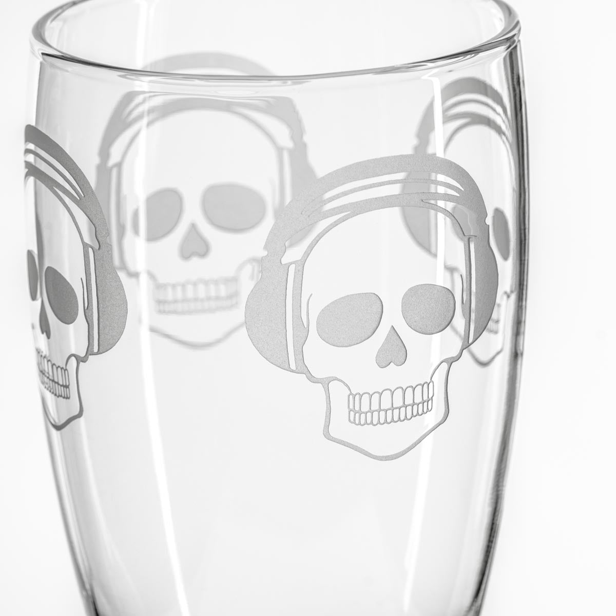 Rolf Glass Numbskulls 20oz Large Pilsner Beer Glass detailed engraving of a skull wearing beats headphones.