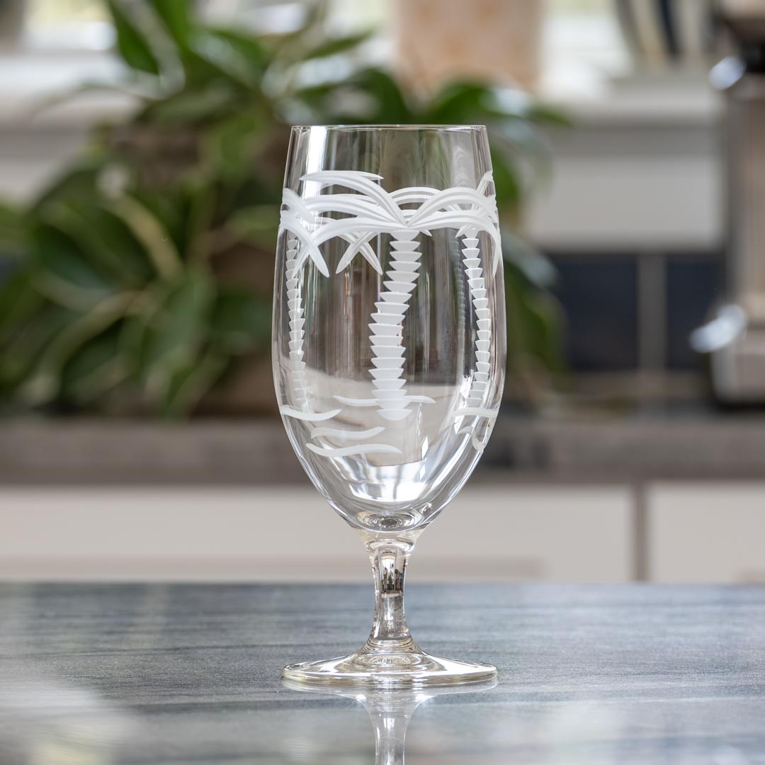 Rolf Glass Palm Tree 16oz Footed Iced Tea glass empty on kitchen counter top