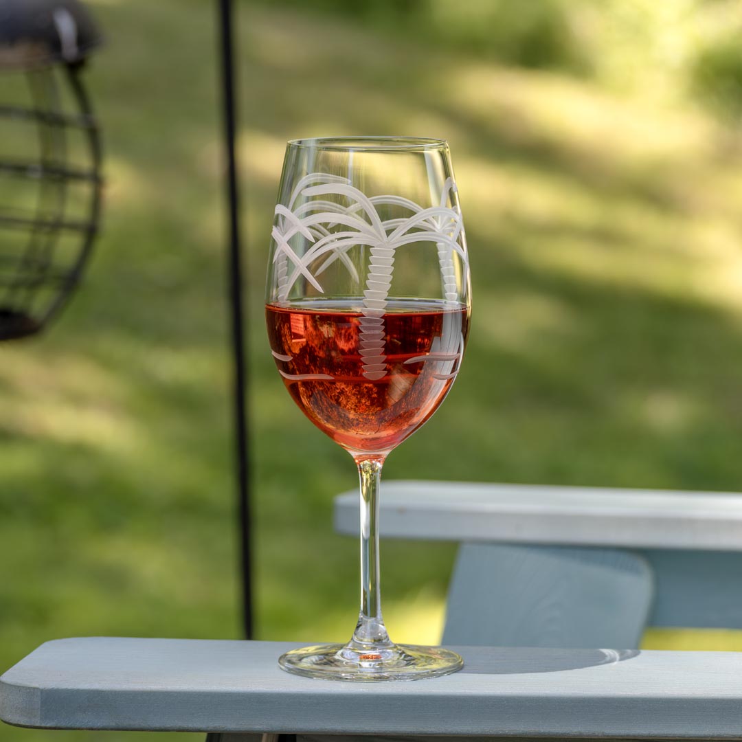 Rolf Glass Palm Tree 18oz All Purpose Wine Glass on the patio