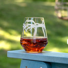 Rolf Glass Palm Tree 18oz Stemless Wine Tumbler on the patio