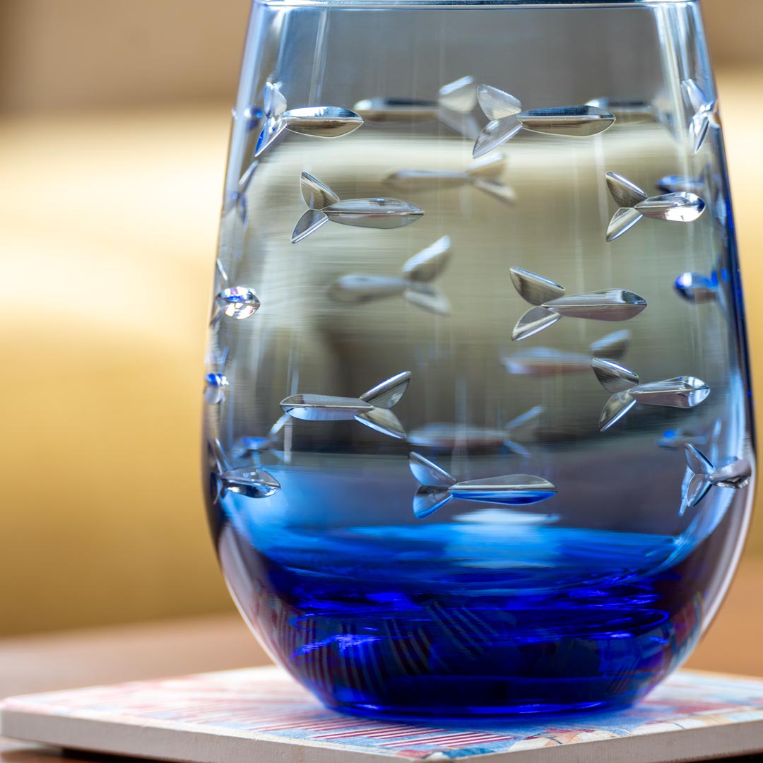 Rolf Glass School of Fish 15oz Blue Stemless Wine Glass close up of fish engraving