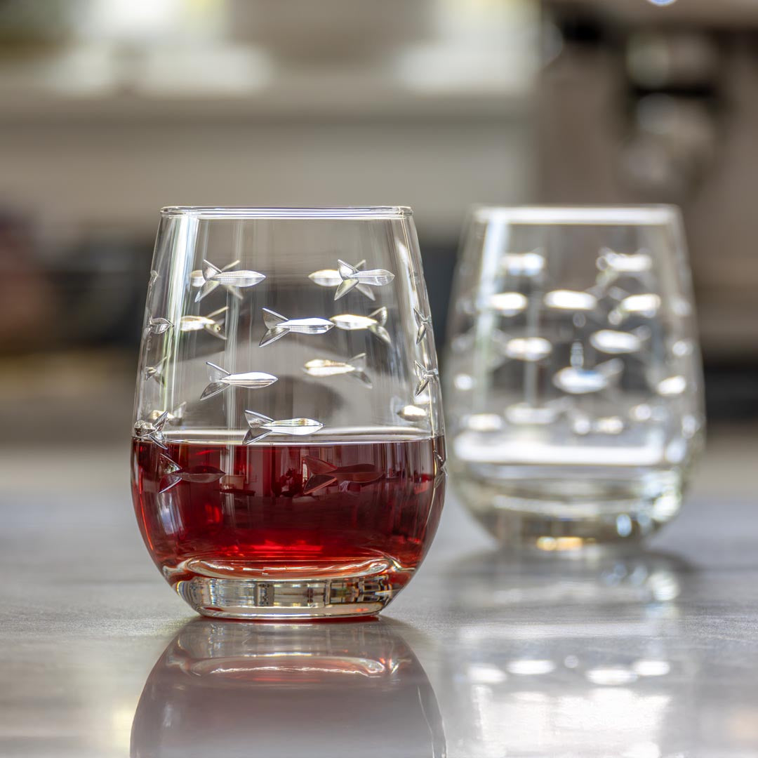 Rolf Glass School of Fish 15oz Clear Stemless Wine Glass in the kitchen full of red wine