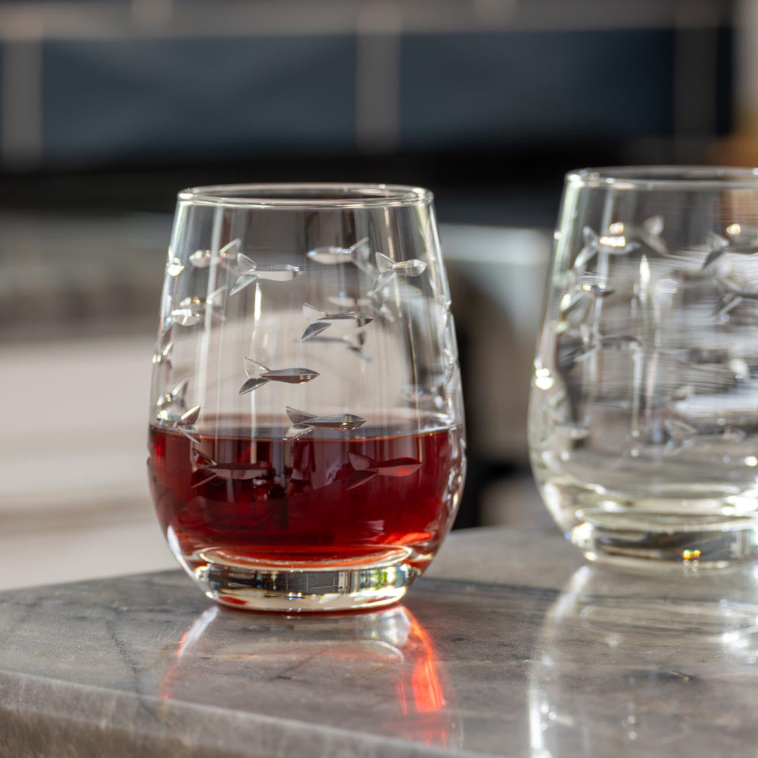 Rolf Glass School of Fish 15oz Clear Stemless Wine Glass in the kitchen full of wine