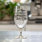 Rolf Glass School of Fish 16oz Footed Iced Tea Glass empty on kitchen counter