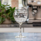 Rolf Glass School of Fish 18oz Balloon Red Wine Glass empty on a granite kitchen counter top