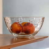Rolf Glass School of Fish 9.25 inch Glass Bowl holding two peaches