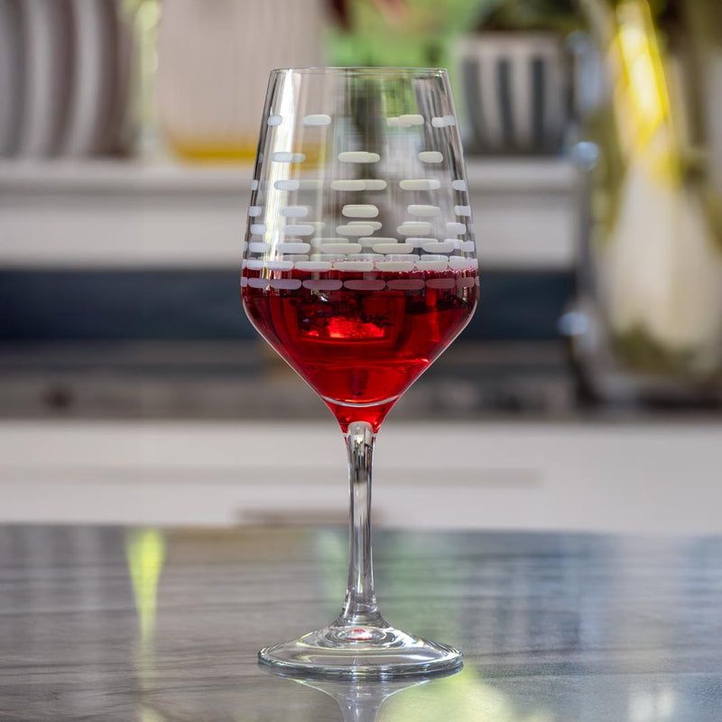 Rolf Glass Strata 18oz All Purpose Wine Glass in the kitchen with a nice red wine