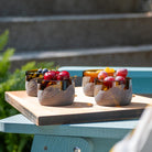 Rolf Glass Twice Around Citrus Garden Mocha 2in Mini Sipper with fresh fruits serving on the patio