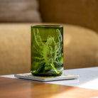 Upcycled Lola Lobster 12oz Dark Green Repurposed Tumbler on a coffee table by Rolf Glass