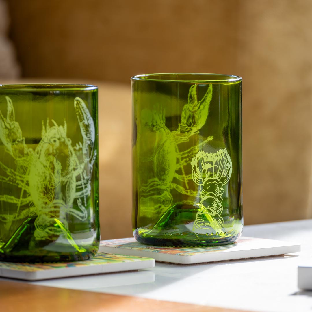 Upcycled Lola Lobster 12oz Dark Green Repurposed Tumbler on a coffee table by Rolf Glass
