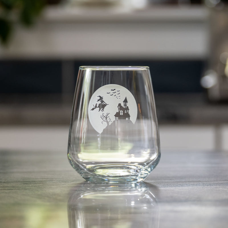 Rolf Glass Jinx Witch 15.75oz Stemless Wine Glass lifestyle photo with a Halloween wine glass on a kitchen counter